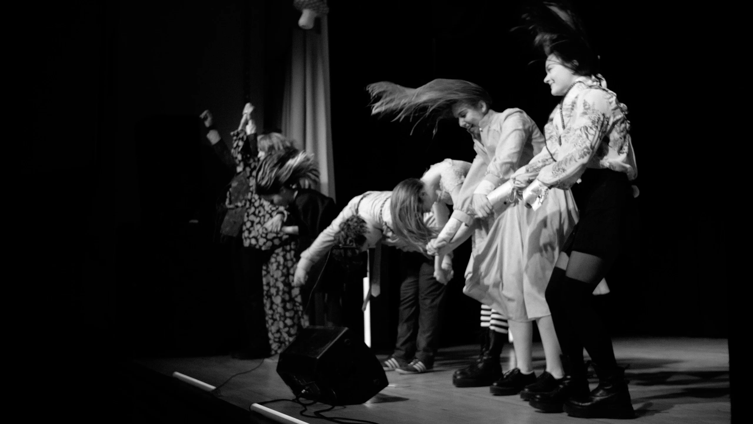Drama performance on stage under warm lights